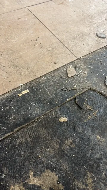 Black bitumen mastic floor removal in a W10 flat